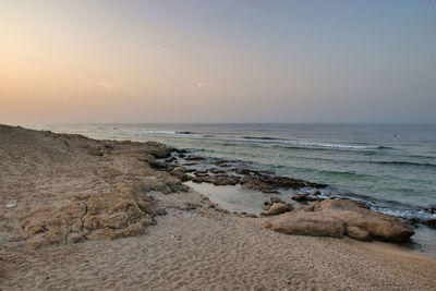 Scenic view of sea against sky during sunset