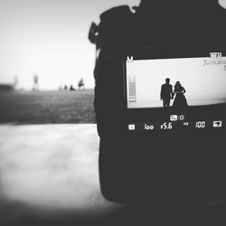 Woman photographing through smart phone