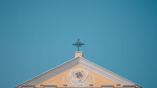 Low angle view of traditional building against clear blue sky