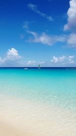 Scenic view of sea against blue sky