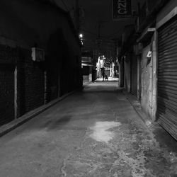 Man in illuminated city at night