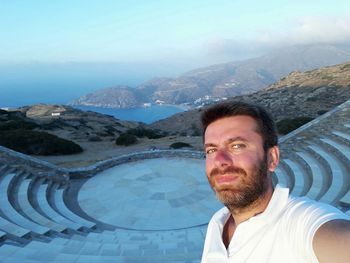 Portrait of man in mountains against sky