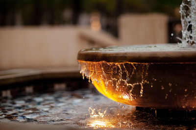 Fantan in a clay bowl, a stream of water, close-up