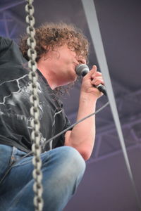 Close-up of man holding rope