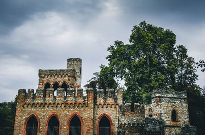 Old building against cloudy sky