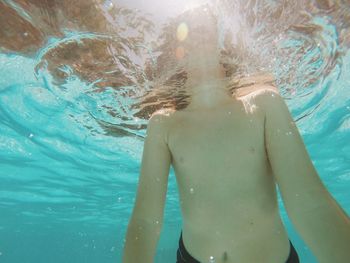 Low angle view of boy in swimming pool