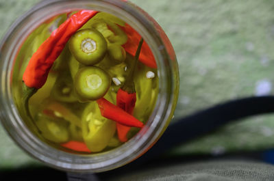 Directly above shot of chopped vegetables in glass container