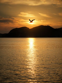 Scenic view of sea against sky during sunset