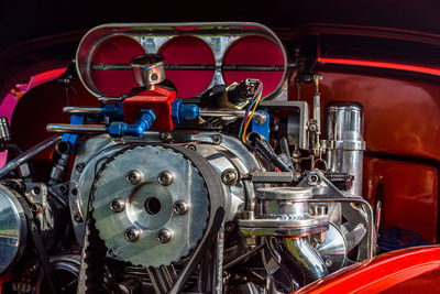 Close-up view of hot rod car engine with belt-driven supercharger or blower