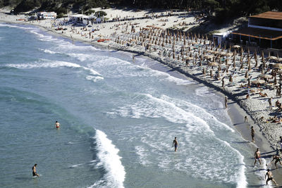 High angle view of people on sea shore