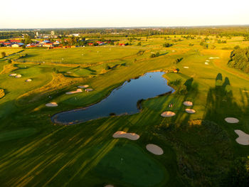 High angle view of green landscape against sky