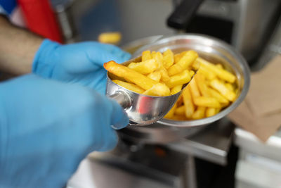 Close-up of person preparing food in kitchen