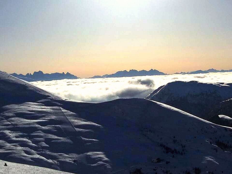 snow, mountain, winter, cold temperature, beauty in nature, nature, scenics, sunset, mountain range, tranquil scene, tranquility, outdoors, sky, no people, aerial view, snowcapped mountain, sunlight, landscape, cloud - sky, travel destinations, day