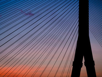 Low angle view of silhouette bridge against sky during sunset