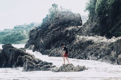 Man standing on rock formation