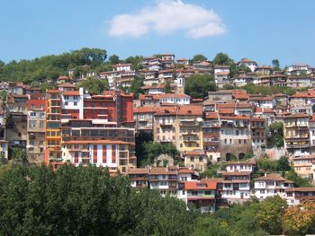 Buildings in city against sky