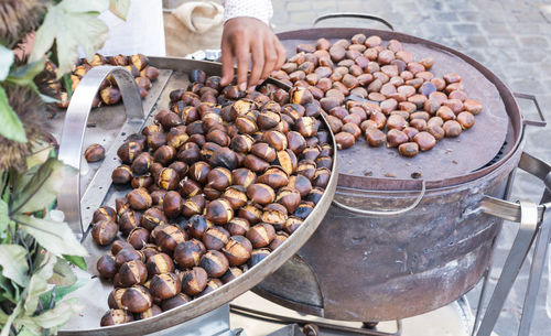 Vendor selling roasted chestnuts at street