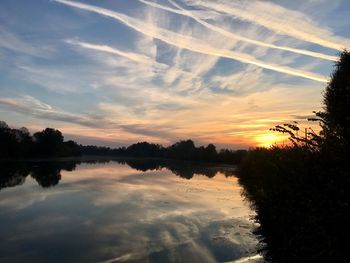 Scenic view of lake against sky during sunset