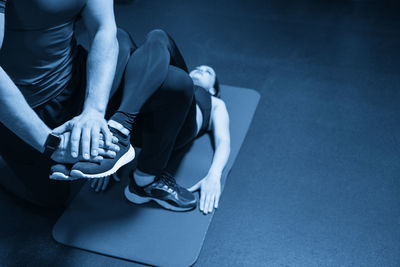 Low section of woman exercising in gym
