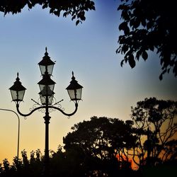 Low angle view of street light against sky