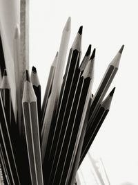 Close-up of pencils against white background