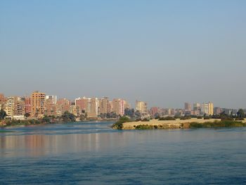 City by sea against sky