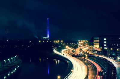 High angle view of light trails on multiple lane highway at night