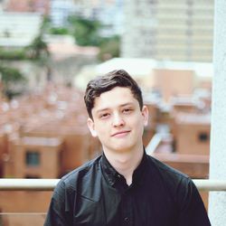 Portrait of young man standing outdoors