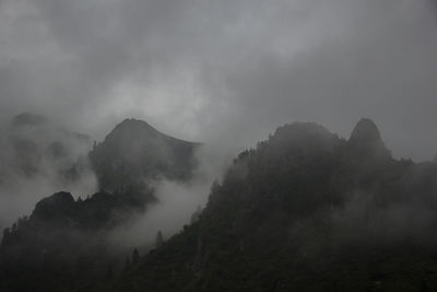 Scenic view of mountains against mist