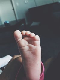 Low section of baby feet