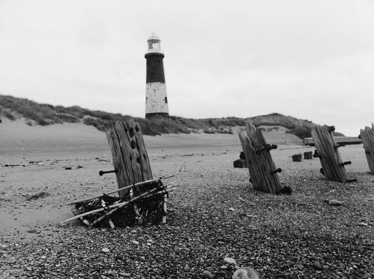 lighthouse, guidance, direction, built structure, architecture, building exterior, protection, sky, water, tower, safety, tranquility, tranquil scene, sea, nature, security, day, mountain, scenics, landscape