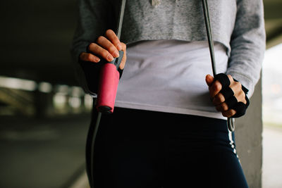 Midsection of woman exercising in gym