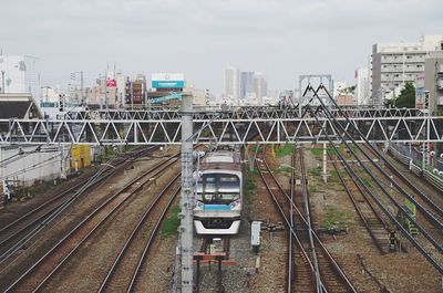 High angle view of train in city against sky