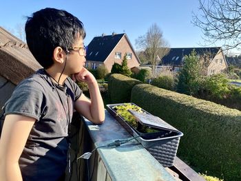 Side view of young man looking away