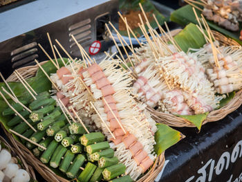 High angle view of mushroom and vegetable skewers for sale in market