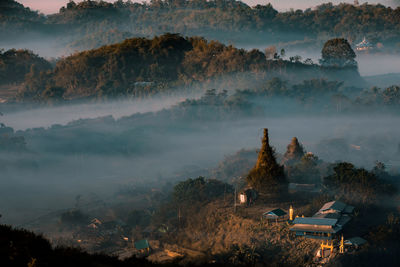 High angle view of trees and buildings against sky