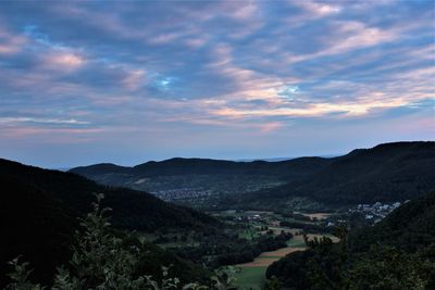 Scenic view of mountains against sky at sunset