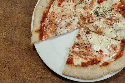 High angle view of pizza in plate on table