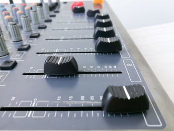 Close-up of sound mixer at recording studio