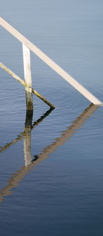 High angle view of wooden post in lake