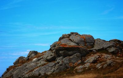 Low angle view of rock formation against sky