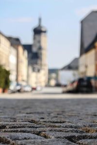 Surface level of road against buildings in city