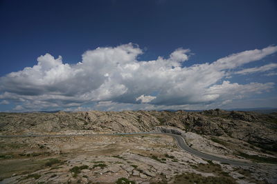 Scenic view of mountain against cloudy sky