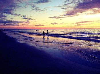 Scenic view of beach against sky during sunset