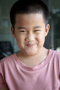 Close-up portrait of smiling boy