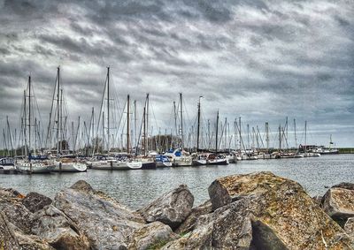 Boats moored at harbor