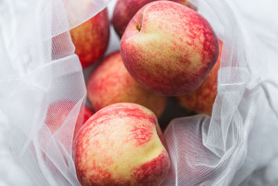 Close-up of apples in sustainable ecofriendly mesh bag