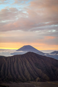 Scenic view of arid landscape against sky during sunrise in bromo tengger semeru national park