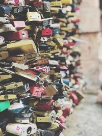 Padlocks hanging on bridge