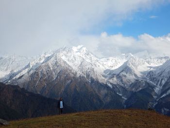 Scenic view of snowcapped mountains against sky